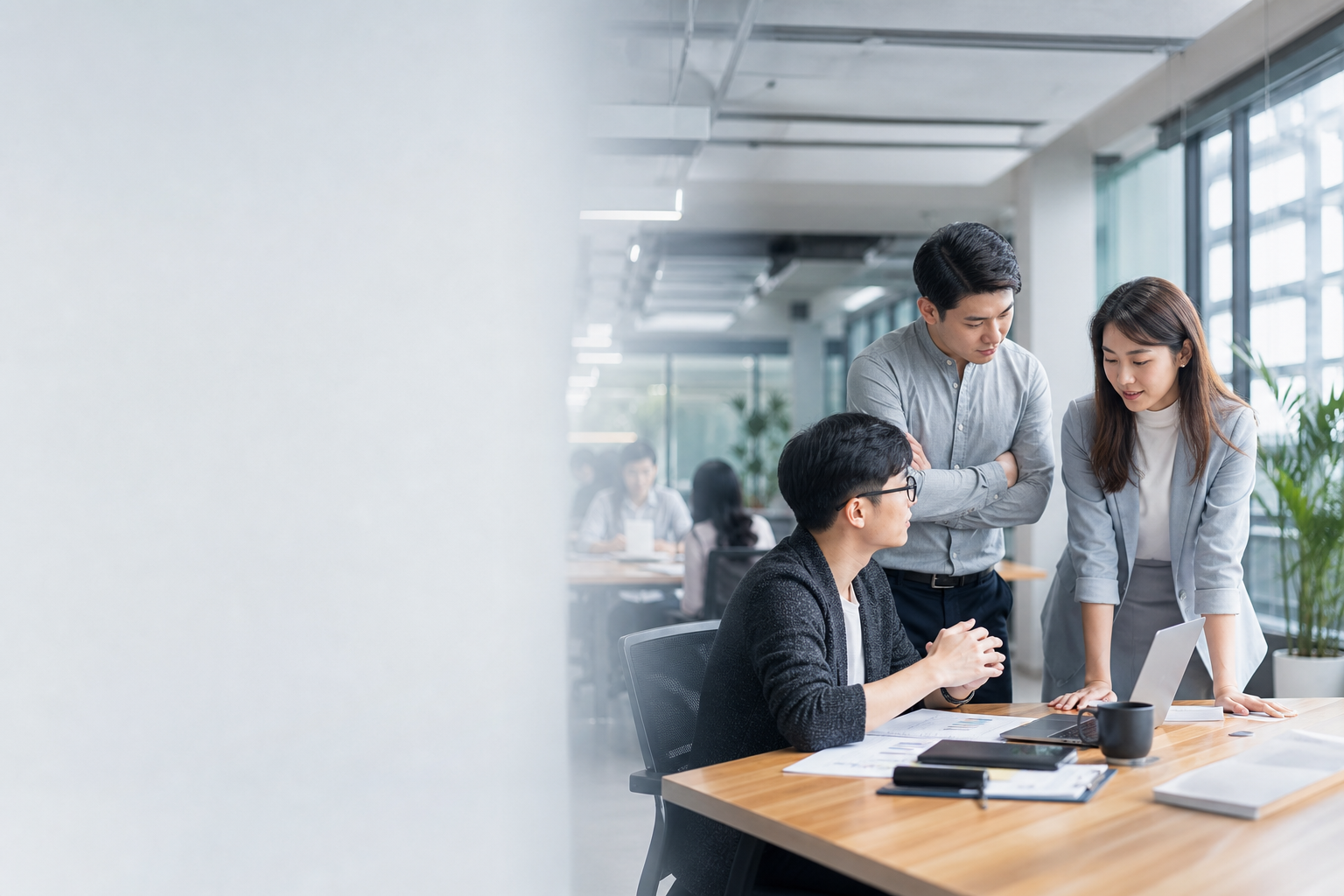 Editorial hero image showing East Asian business professionals interacting collaboratively in a Taiwanese office setting with data flow visual cues symbolizing communication and boundaries.